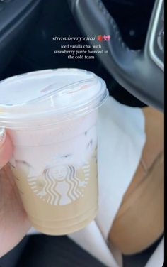 a person holding up a starbucks drink in their hand with the caption that reads, strawberry chai