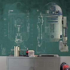 a room with a green chalkboard and a drawing of a r2d2