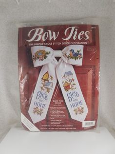 the bow ties are white and have embroidered designs on them, as well as flowers