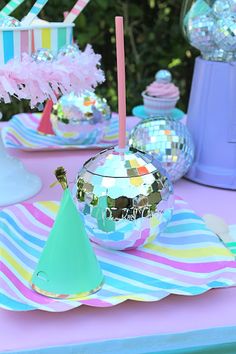 a table topped with lots of shiny objects