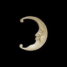 a crescent moon with a man's face in the middle on a black background