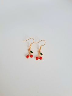 Mini cherry earrings with gold base. Perfect for spring and summer! Summer Gift Cherry Earrings, Red Spring Earrings, Trendy Gold Earrings For Spring, Cherry Colored Earrings Gift, Cherry Dangle Earrings With Ear Wire, Trendy Red Flower Earrings For Summer, Spring Festival Gift Earrings In Metal, Casual Dangle Earrings For Spring, Casual Spring Dangle Earrings