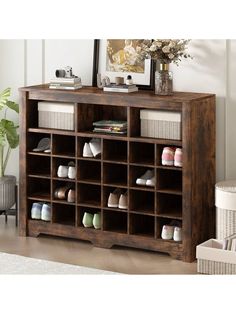 a wooden shoe rack filled with lots of shoes