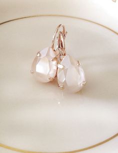 Gorgeous, simple pair of earrings featuring 14x10mm pear cut crystals in ivory cream. Rose gold plated settings, as shown, or gold plated. Please select metal finish from the drop down menu at checkout. Thanks for stopping by. Open Bangle Bracelet, White Bridesmaid, Crystal Teardrop Earrings, Pink Swarovski, Etsy Bridesmaid Gifts, Small Earrings Studs, Bridal Bracelet, Swarovski Crystal Earrings, Wedding Jewelry Earrings