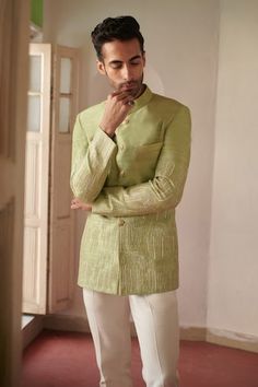 Green full sleeve bandhgala with stitchline thread embroidery in leaf placement pattern. - Aza Fashions Pista Green Long Sleeve Bandhgala For Ceremonial Occasions, Pista Green Long Sleeve Bandhgala For Ceremonial Events, Pista Green Long Sleeve Bandhgala For Formal Occasions, Festive Green Long Sleeve Bandhgala, Pista Green Long Sleeve Designer Bandhgala, Designer Long Sleeve Pista Green Bandhgala, Green Long Sleeve Bandhgala With Naqshi, Pista Green Bandhgala With Chikankari Embroidery, Green Long Sleeve Bandhgala For Festivals