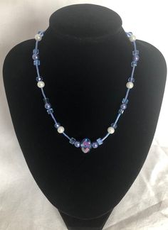 "*Handmade item, one-off design *Materials: magnetic clasp, cornflour blue and white glass pearls, blue cube crystal rondelles, chunky feature crystal rondelle, blue tube beads, strung on quality beading wire *Necklace length: approximately 19\" [48 cm] including the clasp Beautiful beaded necklace with a magnetic clasp. Versatile, suitable for day or evening wear.   Held with a quality attractive magnetic clasp, these clasps are so easy to use if you find hook/toggle clasps fiddly." Blue Pearl Beads For Jewelry Making, Blue Pearl Jewelry With Spacer Beads, Blue Pearl Necklace With Spacer Beads, Adjustable Blue Pearl Necklace With Gemstone Beads, Blue Single Strand Beaded Necklace With Czech Glass, Blue Pearl Necklace With Faceted Beads, Artisan Blue Glass Beaded Necklaces, Blue Necklace With Hand-strung Oval Beads, Blue Polished Glass Beaded Necklace