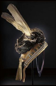 an old hat with feathers on it