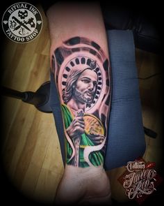 jesus tattoo on the left arm