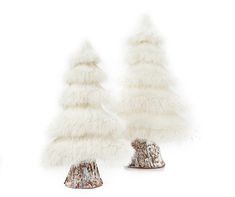 two small white christmas trees with fur on them