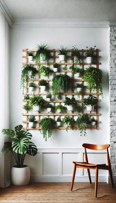 a wall mounted planter filled with potted plants