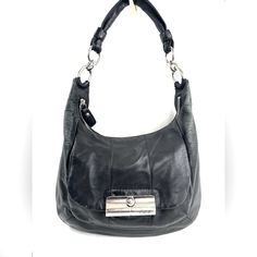 Who Doesn't Luv A Leather Bag You Can Use Everyday And Look Great Doing It? This Coach Kristin 16808 Black Leather Shoulder Bag Will Look Great With Most Of Your Wardrobe. The Front Has A Gusseted Pocket With A Latched Flap And Inside Is A Zipped Pocket And 2 Slip Pockets. Very Good Condition. Minimal Normal Wear. Lots Of Spots Around Inside. No Long Strap. This Is A Pre-Owned Item And May Have Fading Or Discoloration, Marks Or Stains, Scratches, Wrinkling, Wear On Straps, Trim And Texture. If T Coach Kristin Bag, Classic Black Hobo Bag With Metal Hardware, Formal Black Hobo Bag With Metal Hardware, Coach Business Shoulder Bag With Branded Hardware, Coach Shoulder Bag With Gunmetal Hardware For Business, Coach Satchel Shoulder Bag With Metal Hardware, Coach Hobo Shoulder Bag With Branded Hardware, Coach Rectangular Shoulder Bag With Snap Closure, Coach Shoulder Bag With Silver-tone Hardware