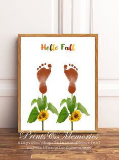 a baby's footprints and sunflowers with the words hello fall on it