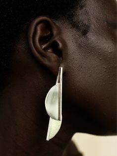 These Half Moon Jacket Earrings by Ami Doshi Shah are made from recycled silver, with contrasting textures adding interest to the minimalist, sculptural shape. Each piece is meticulously handcrafted in Nairobi, Kenya, and meant to become a personal talisman, reminding the wearer to cherish the fleeting moments of life. - Post-back closure for pierced ears- Recycled silver - Created using ethically and sustainably sourced materials- Each piece is made to order and may take up to 2 weeks to comple Modern Hand Cast Sterling Silver Earrings, Moon Jacket, African Luxury, Contrasting Textures, Jacket Earrings, Moments Of Life, Nairobi Kenya, Earring Jackets, Red Carpet Ready