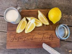 a cutting board that has some lemons on it