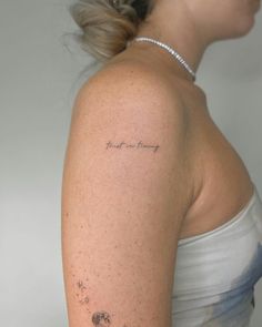 a woman with a tattoo on her arm saying, i love you mommy and stars