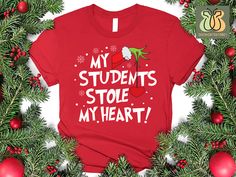 My Students Stole My Heart Christmas Shirt, Teacher Xmas Shirt, Grinch Teacher Shirt, Student Lovers Shirt, Christmas Teacher Outfit 👕How To Order👕 1-) Please, check and review all photos 2-) Choose your t-shirt size and color 3-) Click add to cart. You can go back to add more product 4-)Click "Proceed to check out" 5-)When you check out, you can add a note to seller for any request Unisex Shirts The crew neck, short sleeves, and excellent airlume combed and ring-spun cotton construction of th Teacher Shirts Vinyl Grinch, Christmas Shirts For Teachers Vinyl, Christmas Teacher Shirts Vinyl, Grinch Nurse Shirt, Christmad Teacher Shirts, Xmas Shirts, Teacher Outfit, Teacher Christmas, Unisex Shirts