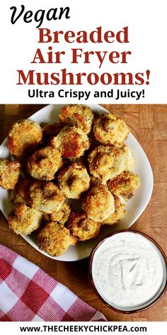 a plate with fried air fryer mushrooms next to a bowl of ranch dressing