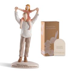 a figurine with a box on the side and a card in front of it