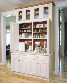 an image of a kitchen with white cabinets