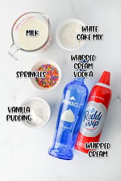 ingredients needed to make white cake mix on a marble counter top, including whipped cream, sprinkles, vanilla pudding and whip cream