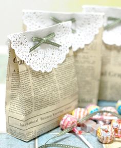 two paper bags sitting on top of a table