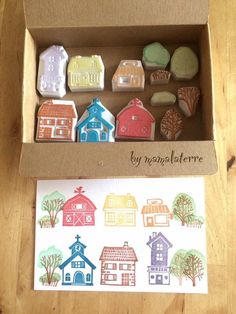 a box filled with lots of different types of cookies on top of a wooden table