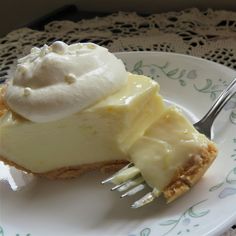 a piece of cheesecake on a plate with a fork