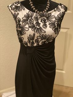 This is a beautiful brand new Connected Apparel Dress. It is made of polyester and spandex. It is black and white on top, and all black on bottom. The bottom of the dress has a wrap around style. It is a US size 8. The dress is sleeveless with a scrunched waist. Ships Immediately! 36” Bust 30” Waist 42” Hips 36.5” Length Type: Dress Brand: Connected Apparel Size Type: Regular Women's Size: 8 Material: Polyester, Spandex Season: Spring - Summer, Fall - Winter Colors: Black, White Condition: New W Black And White Sleeveless Evening Mini Dress, Elegant Sleeveless Black And White Mini Dress, Fitted Black And White Cocktail Dress, Black And White Mini Dress For Evening, Formal Sleeveless Black And White Dress, Fitted Black And White Party Dress, Elegant Black And White Dress For Night Out, Connected Apparel Dress, Pre Black Friday