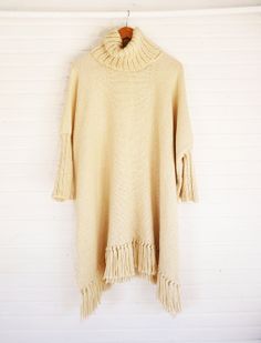 Cape Coat, turtle neck Wrap, Cloak Women Outerwear wool poncho, handwoven knitted in merino wool by Texturable Cozy Wool Poncho Cape, Oversized Alpaca Poncho For Winter, Oversized Fringe Cape For Winter, Oversized Cream Merino Wool Sweater, Beige Fringe Poncho For Fall, Cozy Wool Poncho One Size, Beige Alpaca Poncho One Size, One Size Beige Alpaca Poncho, Beige Alpaca One-size Poncho