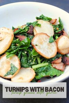 a white bowl filled with spinach and potatoes