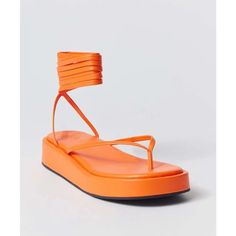 Urban Outfitters Jaida Platform Tie Up Thong Sandal In Orange Spring Platform Sandals With Toe Loop, Urban Outfitters Open Toe Synthetic Sandals, Spring Vacation Lace-up Toe Loop Sandals, Orange Single Toe Strap Sandals For Spring, Spring Vacation Toe Loop Lace-up Sandals, Summer Platform Flip Flops With Single Toe Strap, Spring Adjustable Platform Flip Flops, Orange Toe Post Sandals For Summer, Toe Loop Wedge Sandals For Vacation In Spring