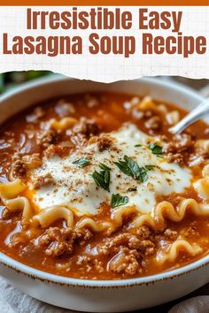 a white bowl filled with lasagna soup on top of a wooden cutting board