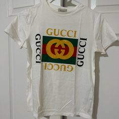 Original Gucci Shirt. Size Youth 10 But Fits A Extra Small/ Small Women. Casual Gucci Short Sleeve T-shirt, Trendy Gucci Cotton T-shirt, Gucci Short Sleeve T-shirt With Logo Print, Trendy Gucci Crew Neck T-shirt, Gucci Cotton Graphic Print T-shirt, Gucci Shirt, Gucci Top, Gucci T Shirt, Red And White