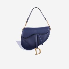 The cherished and emblematic Saddle Bag from Dior makes a surprising comeback in 2018. Reinvented in two different sizes and more colours than ever before, the Classic Dior Saddle Bag in white has now landed at bagsalora. Bursting with class and flair, the Dior Saddle Bag is great for adding the finishing touch to your outfit. SPL Exterior   Navy Calfskin GHW   Gold toned hardware Hanging D charm Top handle design Stud closure Great condition - some minor scratches to exterior    Interior   Textile lining Single storage compartment Zip pocket Excellent condition - some small marks  Sold with dustbag and card   SPL  Height 20.5cm Width 25.5cm Depth 6.5cm Classic Dior, Dream Wishlist, Interior Textile, Interior Textiles, Dior Saddle, Rose Gold Hardware, Handle Design, Navy Leather, Timeless Handbag