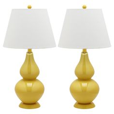 two yellow lamps sitting next to each other