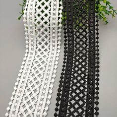 two pieces of black and white lace with flowers