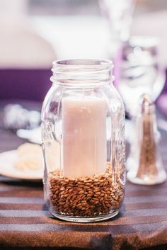 a jar filled with some kind of food on top of a table