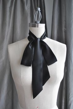 "Announcement My shop currently accepting orders with prolonged production period! All custom orders will be shipped after January,25th. Have a happy Holidays NEW Unique and simple neck piece. Endless possibilities to style it. Can be worn as a bow tie, tie, bow at the back, with your favorite brooch, like a belt, like a scarf and more. Be unique, Be different, Be yourself! Made of beautiful silk charmeuse. Color black. Size is about 2\" wide and 60\" long The listing is for ONE scarf black colo Women Bow Tie Outfit, Narrow Scarf, Bow Choker, Black Silk Scarf, Head Scarf Tying, Bow Scarf, Tie Women