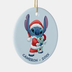 a christmas ornament with a cartoon character holding a stuffed animal in it's arms