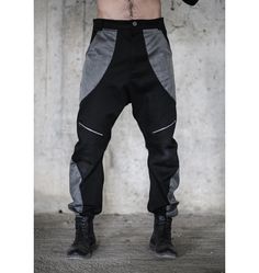 Denim pants with functional zipper pockets. The model on the picture is wearing size L. His measurements are waist 78cm, hips 97cm, height 187cm. Collection 'EVOLUTION' AW21/22 *If you are not sure about your size please get in touch with us so we can refer the best fit for you. Black Techwear Parachute Pants With Zip Fly, Alternative Style Black Pants With Zip Fly, Urban Parachute Pants With Zip Fly For Streetwear, Urban Black Pants With Zip Fly, Urban Black Pants For Alternative Fashion, Black Urban Pants With Zip Fly, Urban Cargo Pants For Alternative Fashion, Avant-garde Black Pants For Streetwear, Avant-garde Baggy Black Pants