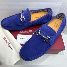 New And Absolutely Stunning Salvatore Ferragamo Loafers In Blue Suede, Embellished With The Distinctive Gancini Ornament In Silver-Tone Metal. New With Original Box, Dustbag And Booklet. Soft, Supple Driver Loafer. The Upper Features Visible Stitching Around The Seam And A Palladium Tone Gancio Bit For An Elegant Finish. Custom Rubber Sole. This Shoe Is Made With The "Tubular" Technique, An Exclusive Method Applied By High End Shoemakers, Whereby The Sole Is Hand-Sewn To Ensure A Supple, Flexibl Elegant Blue Slip-on Moccasins, Elegant Blue Moccasins For Business, Elegant Blue Moccasins With Leather Sole, Luxury Blue Loafers For Business, Luxury Blue Business Loafers, Designer Loafers With Suede Lining For Galas, Formal Blue Flat Loafers, Blue Leather Shoes With Flat Leather Sole, Designer Blue Loafers For Business