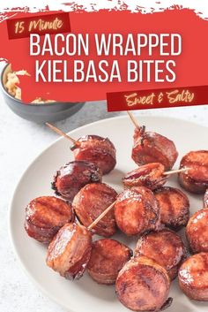 bacon wrapped kielbasa bites on a white plate with a red banner in the background