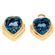 Earrings Specifications: Metal: 18K Yellow Gold Total Weight: 10.3 Grams Gemstone: Blue Topaz Topaz Measurements: 10.88 x 10.6 x 6.7 mm Earring Measurements: 16 mm x 14 mm Stamped: "750" "Mayors" Condition: Preowned, Excellent Topaz Yellow, Gold Sign, Blue Topaz Earrings, Topaz Earrings, Fine Watches, Blue Heart, Fine Jewellery Earrings, Estate Jewelry, Jewelry Earrings Studs