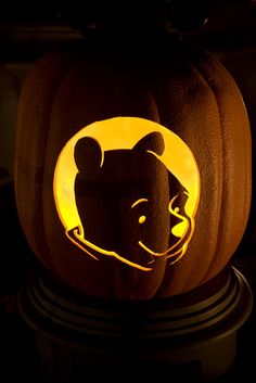 a carved pumpkin with the head of winnie the pooh on it