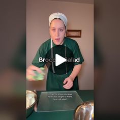 a woman in green scrubs standing next to a table with food on it and the caption reads brocco salad