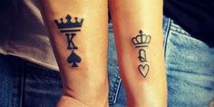 two people with matching tattoos on their arms, one has a crown and the other has hearts