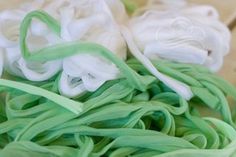 some white and green colored noodles in a bowl