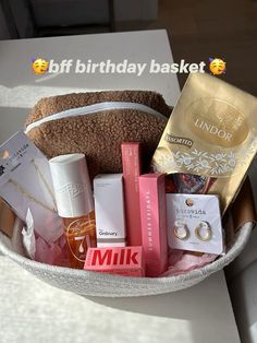 a white basket filled with lots of different items