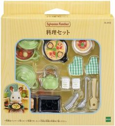 an assortment of kitchen utensils in a box with japanese writing on the front