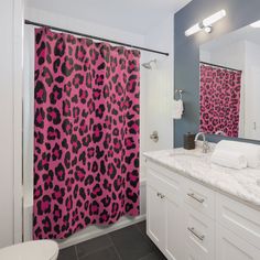 a purple and black shower curtain in a bathroom